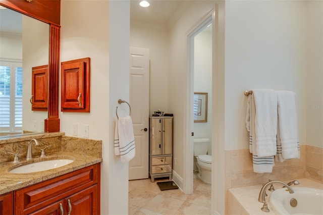 bathroom featuring tile patterned flooring, tiled tub, crown molding, toilet, and vanity