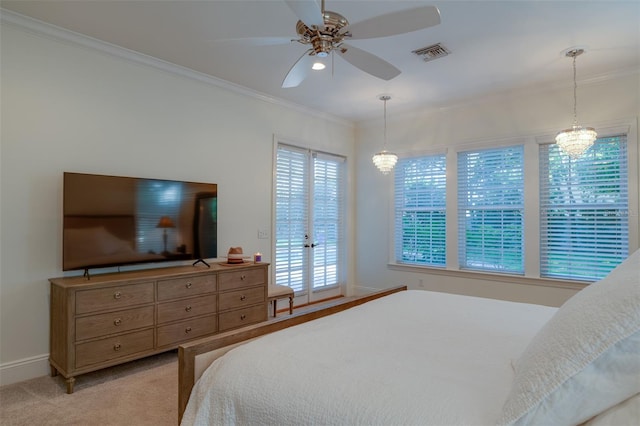 carpeted bedroom with access to exterior, ceiling fan with notable chandelier, and ornamental molding