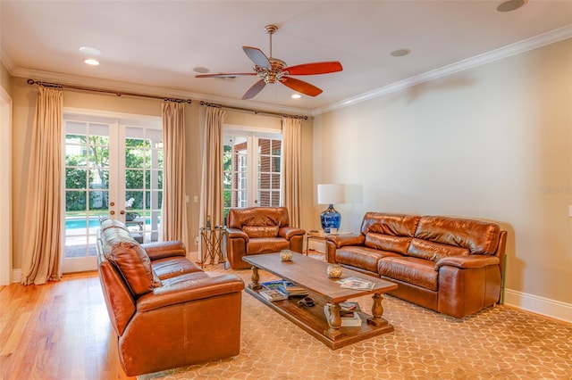 living room with french doors, ceiling fan, and crown molding