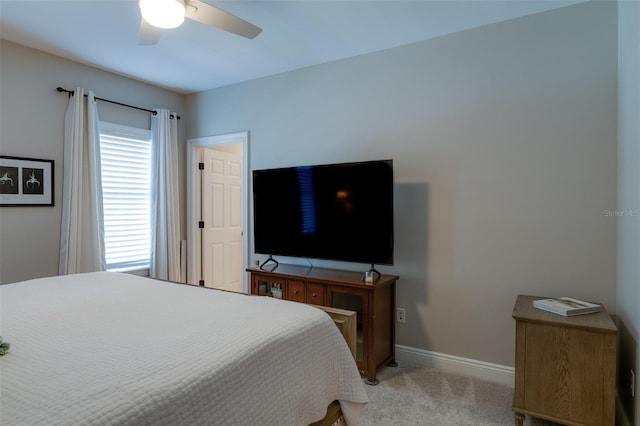 bedroom with ceiling fan and light colored carpet