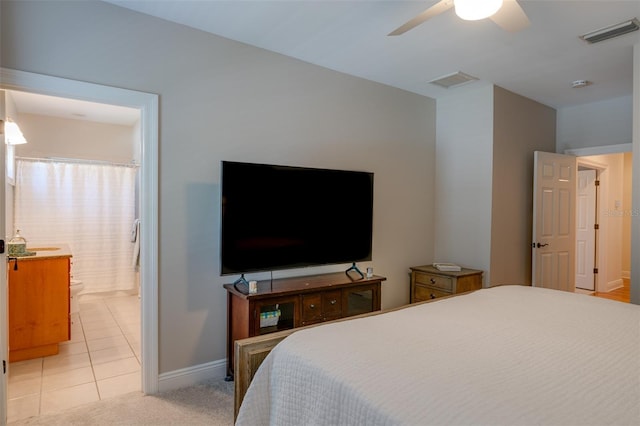 bedroom with ceiling fan and light colored carpet