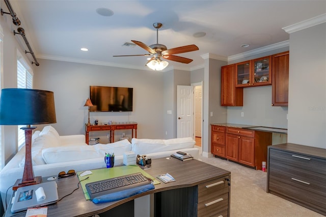 interior space featuring ceiling fan, crown molding, and light colored carpet