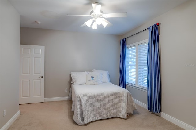 bedroom with light carpet and ceiling fan