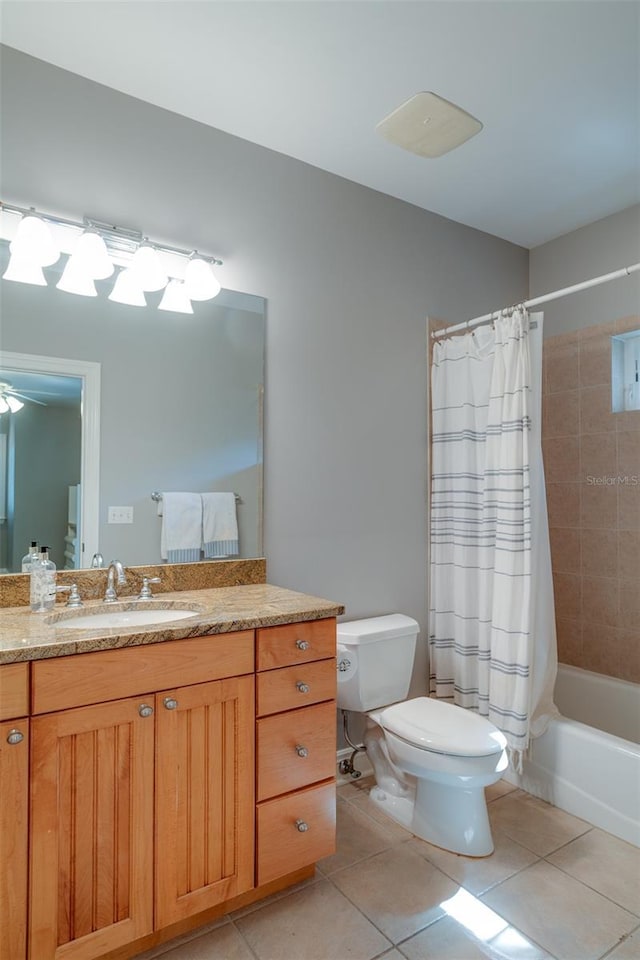 full bathroom with tile patterned flooring, vanity, toilet, and shower / tub combo with curtain