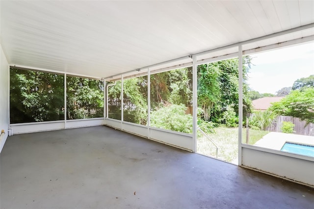 unfurnished sunroom featuring a wealth of natural light