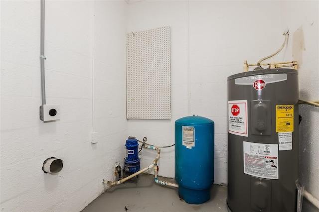 utility room featuring water heater