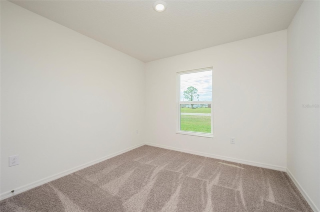 unfurnished room featuring carpet flooring