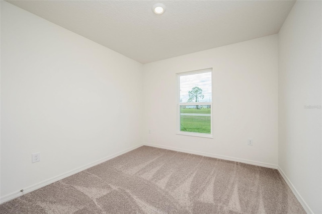 unfurnished room with carpet floors