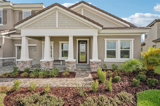 craftsman inspired home featuring covered porch