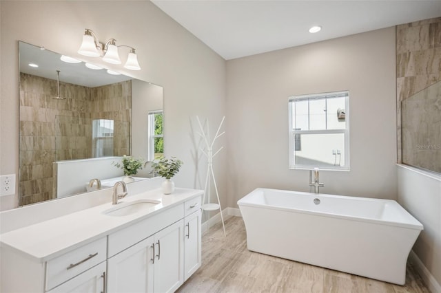 bathroom featuring plus walk in shower and vanity