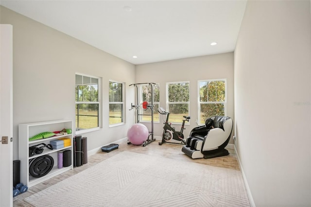 workout room with plenty of natural light