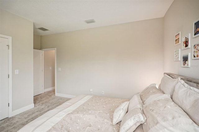 bedroom with light colored carpet