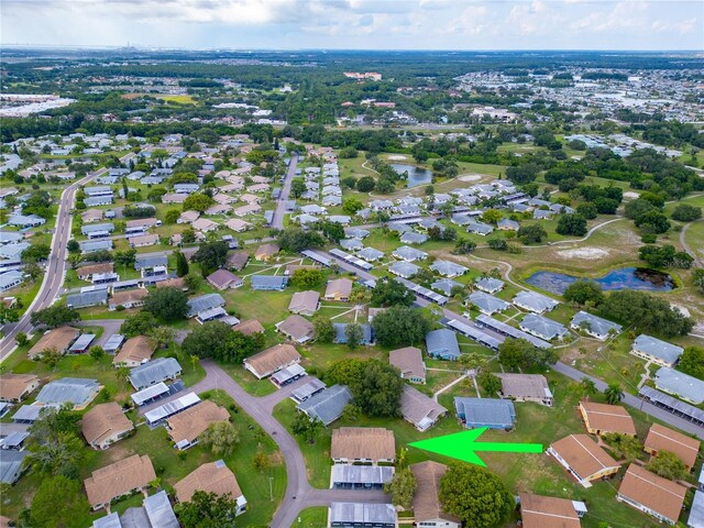 bird's eye view featuring a water view and a residential view