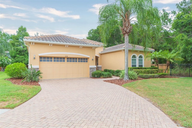 mediterranean / spanish house with a front lawn