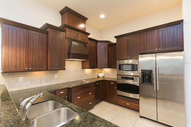 kitchen featuring custom exhaust hood, sink, decorative backsplash, light tile patterned floors, and stainless steel appliances