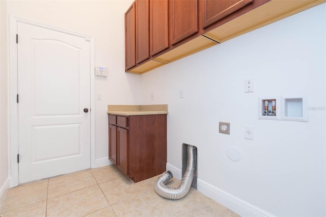 laundry room featuring cabinets, washer hookup, gas dryer hookup, electric dryer hookup, and light tile patterned floors