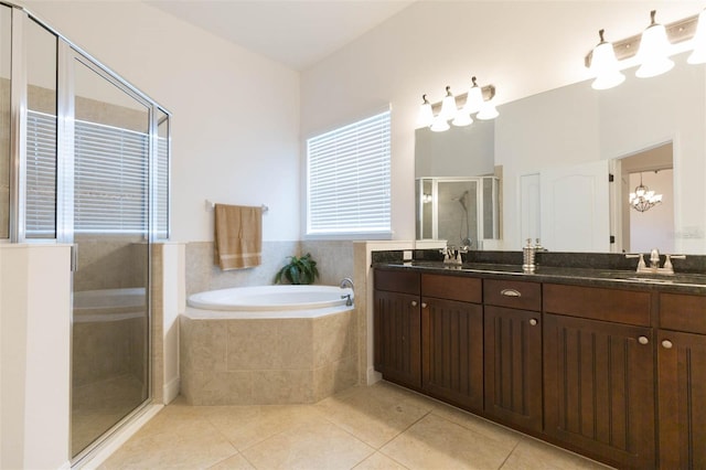 bathroom with shower with separate bathtub, vanity, tile patterned floors, and a notable chandelier