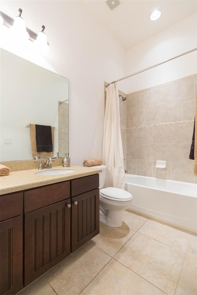 full bathroom featuring toilet, shower / tub combo, vanity, and tile patterned floors