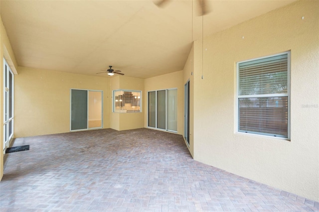 view of patio featuring ceiling fan