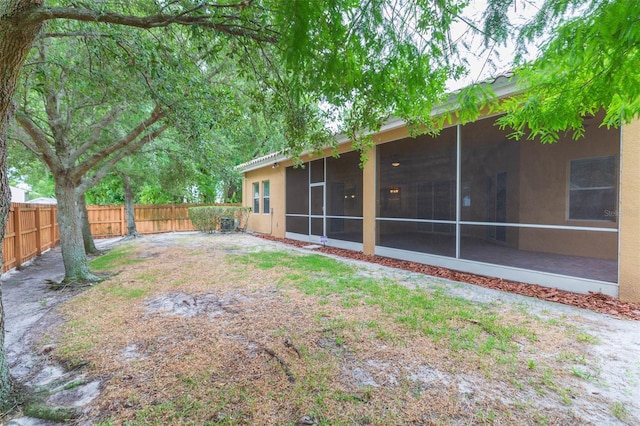 view of yard with a sunroom