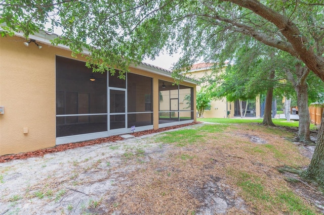 view of yard with a sunroom