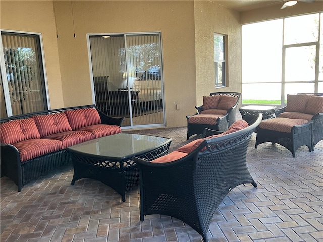 view of patio / terrace with an outdoor living space and ceiling fan