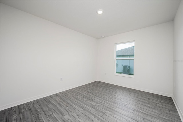 empty room with hardwood / wood-style floors