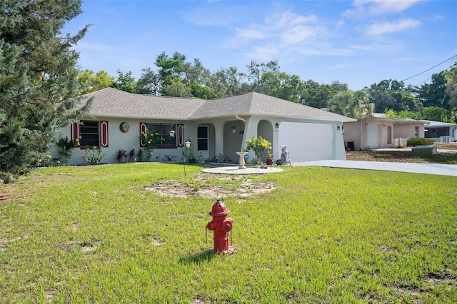 ranch-style house featuring a front yard and a garage