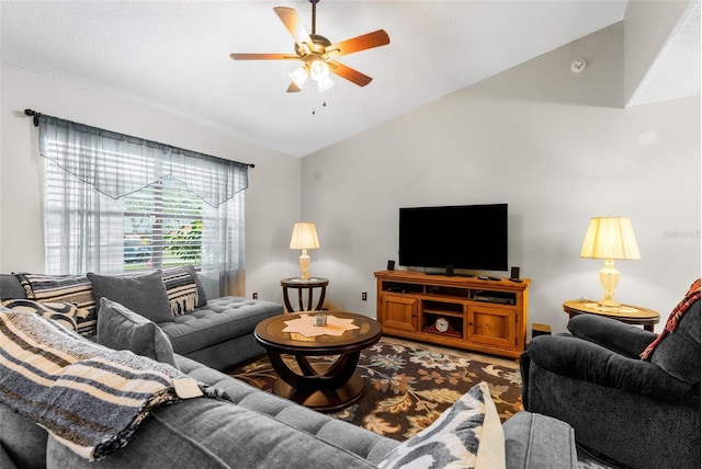 living room with ceiling fan and lofted ceiling