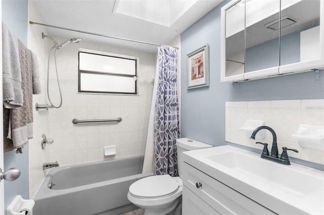 full bathroom with shower / bath combination with curtain, toilet, backsplash, and vanity