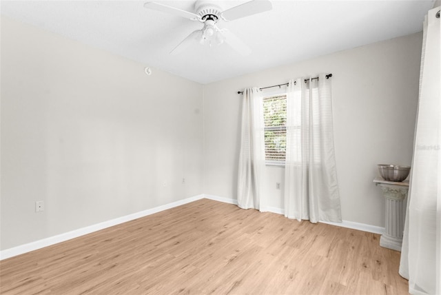 empty room featuring ceiling fan and light hardwood / wood-style floors