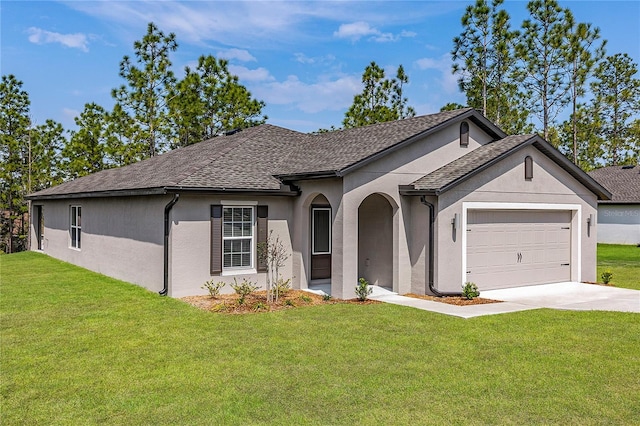 single story home with a front yard and a garage