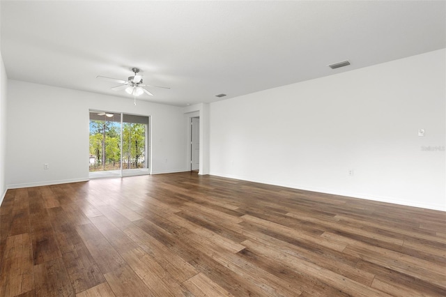 spare room with hardwood / wood-style floors and ceiling fan