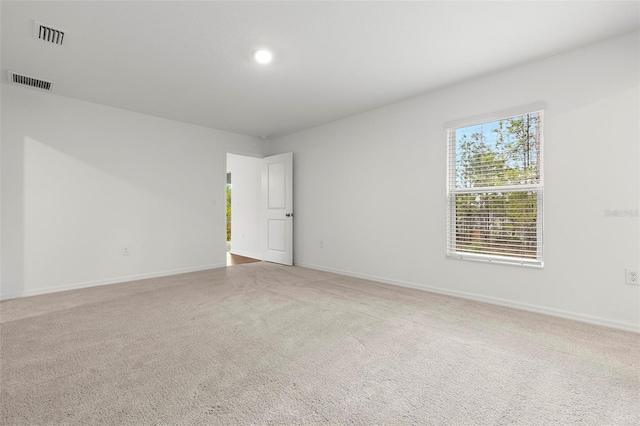 unfurnished room featuring carpet floors