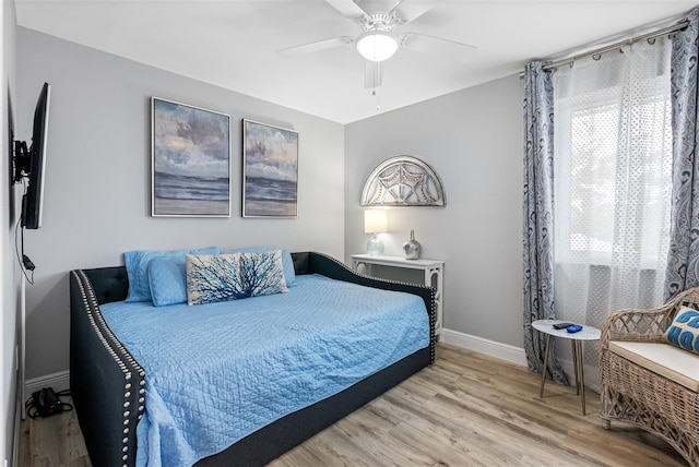 bedroom featuring light hardwood / wood-style flooring and ceiling fan