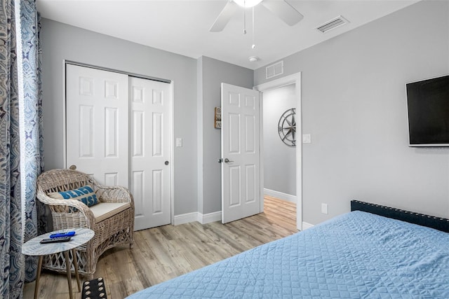 bedroom featuring a closet, ceiling fan, and light wood-type flooring