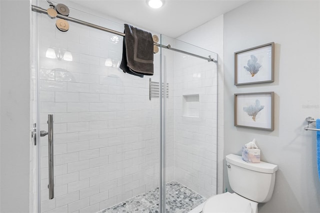 bathroom with toilet and walk in shower