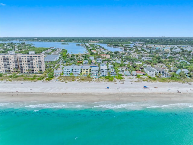 bird's eye view featuring a view of the beach and a water view