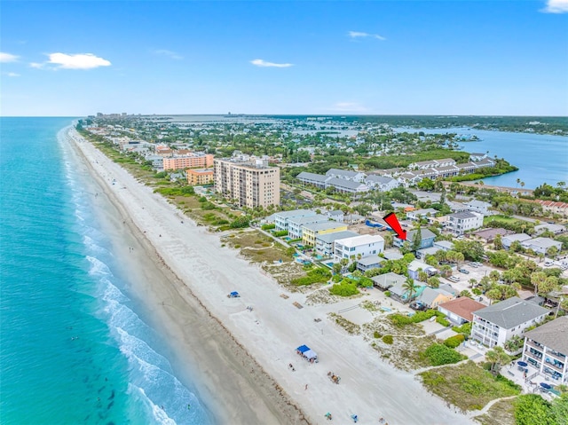 drone / aerial view featuring a view of the beach and a water view