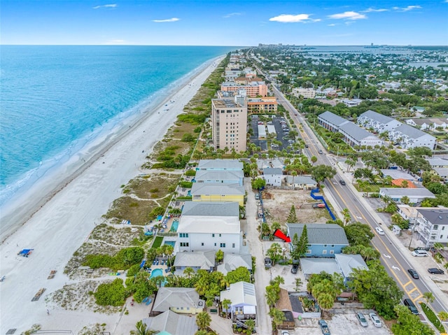 aerial view with a water view and a beach view