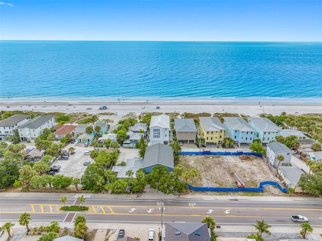 bird's eye view with a beach view and a water view