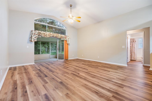 interior space with lofted ceiling, hardwood / wood-style floors, and ceiling fan