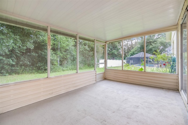 unfurnished sunroom with a wealth of natural light