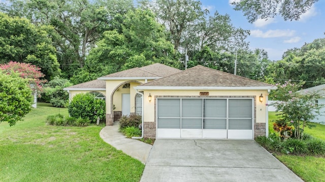 view of front facade featuring a garage and a front lawn