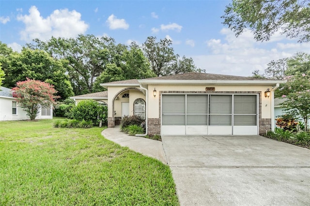 view of front of home featuring a garage and a front lawn