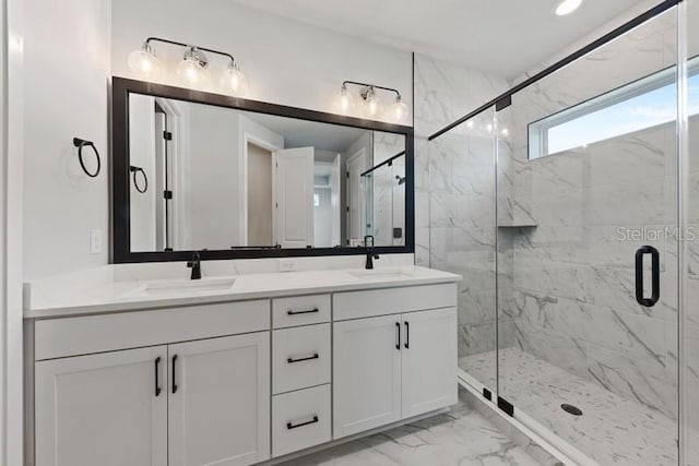 bathroom featuring vanity and a shower with door