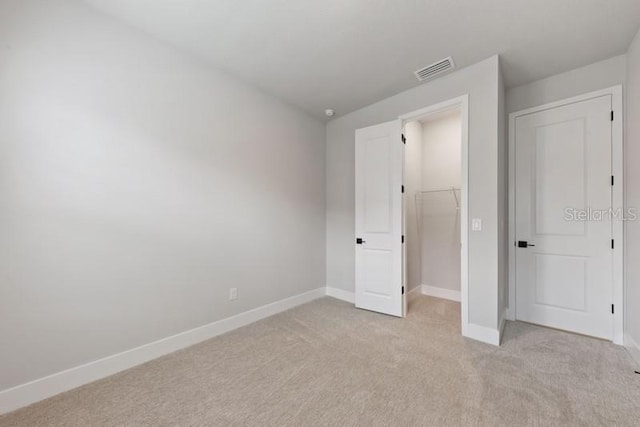 unfurnished bedroom with light carpet