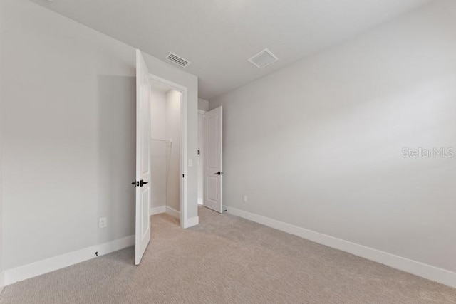 unfurnished bedroom with light carpet