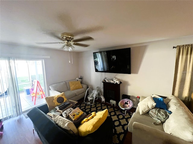 living area featuring ceiling fan and wood finished floors