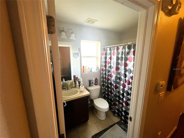 bathroom featuring visible vents, toilet, a shower with curtain, tile patterned floors, and vanity